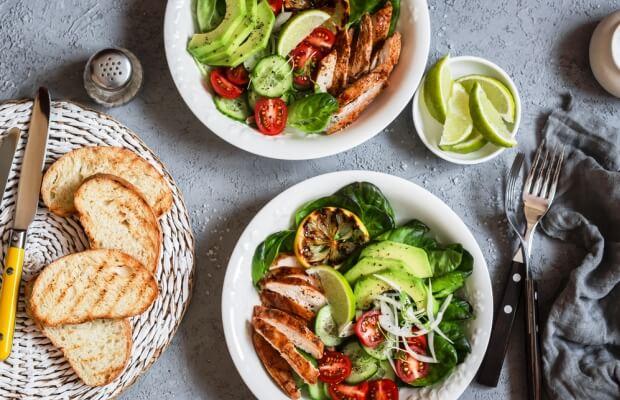 Balanced meal with chicken salad vegetables and bread