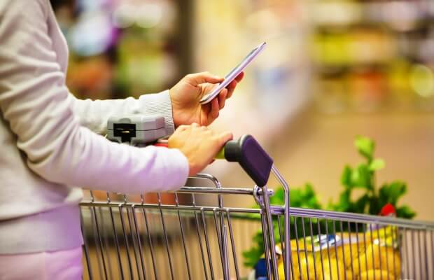 Supermarket shopping with list on a smartphone