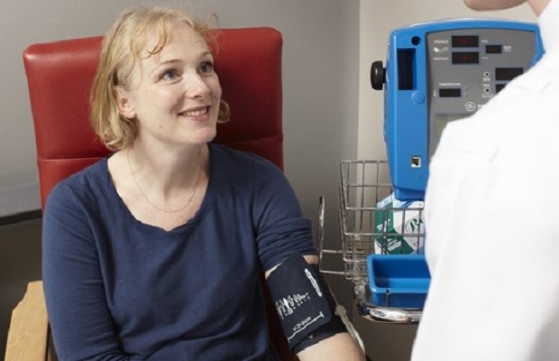 Woman having her blood pressure checked