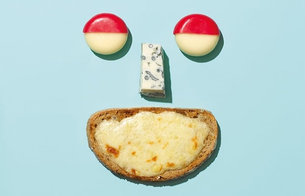 A face made of cheese A face made out of different types of cheese