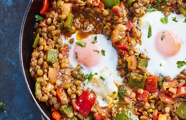 Spanish-style lentils with eggs in a frying pan