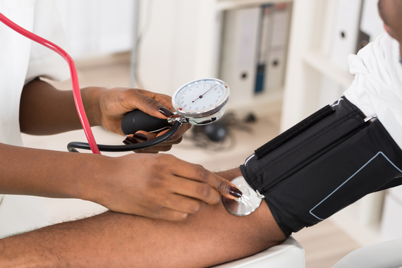 Patient getting their blood pressure checked