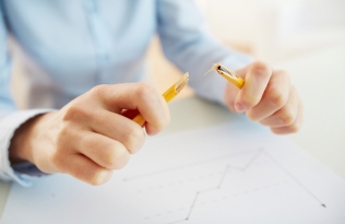 stressed man snapping pencil
