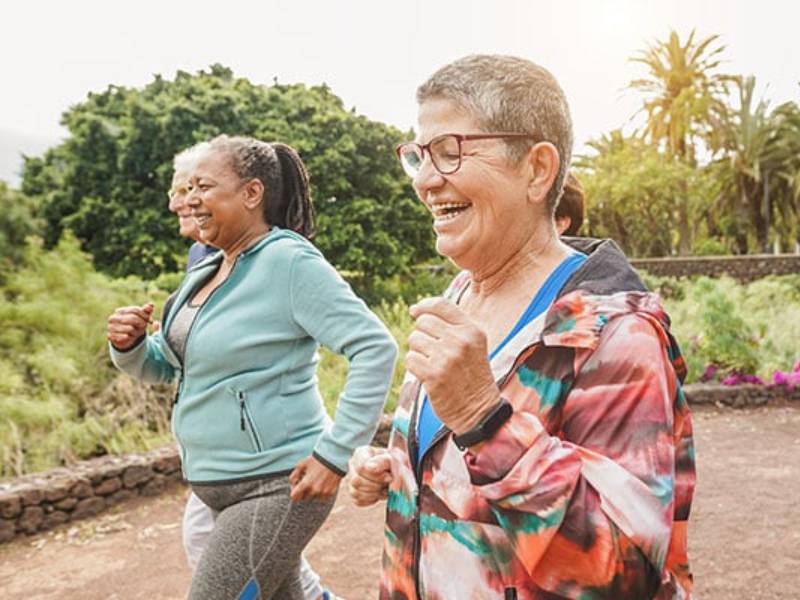 Three women going for a jog outside.