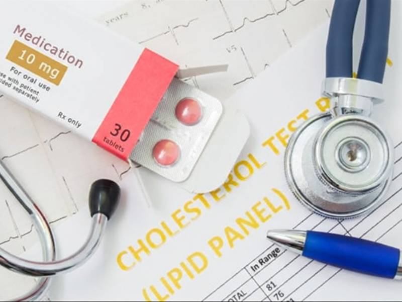 A blister pack of medicine next to a stethoscope.