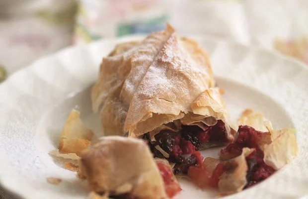 Apple and raspberry strudel in a bowl