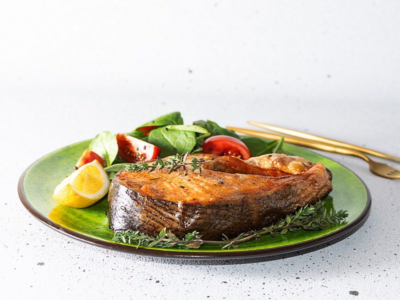 Oven-baked salmon with lemon and fresh herbs