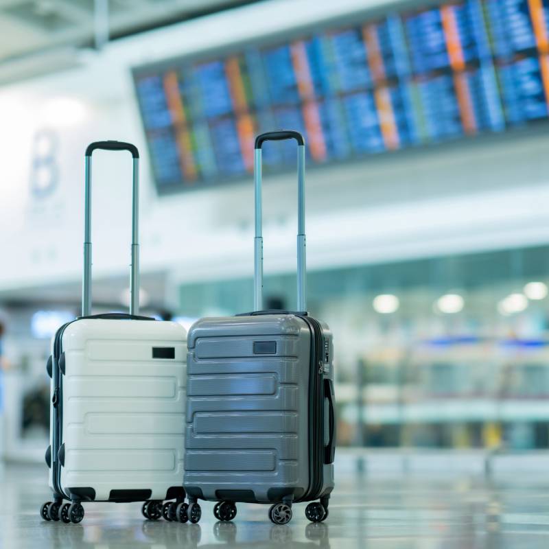 2 suitcases in an airport