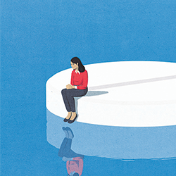 Woman sat on the edge of a large white tablet staring into the water