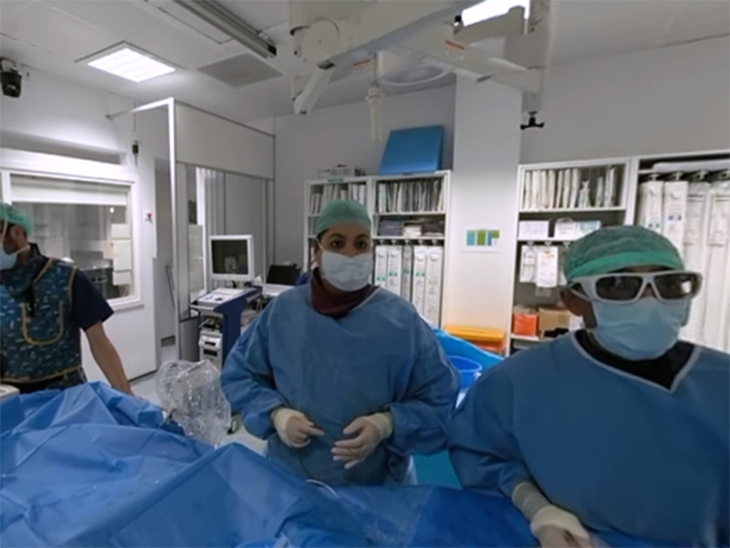 Three healthcare professors preparing to perform an angiogram