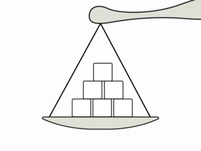Monochrome line drawing of sugar cubes on a kitchen scales.