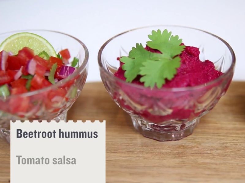 A bowl of beetroot hummus and tomato salsa
