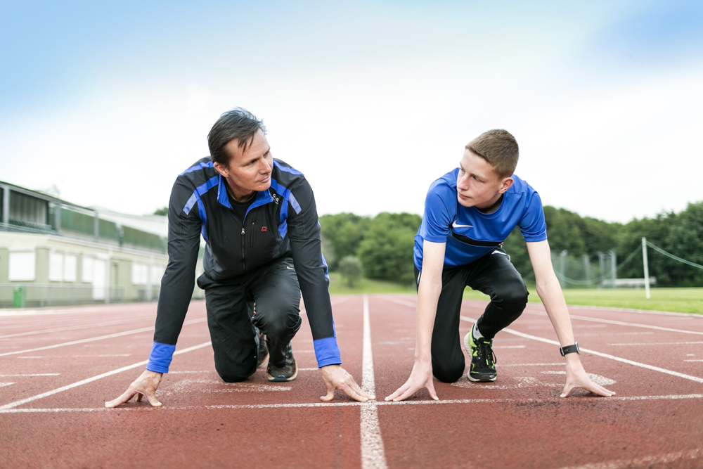 Roger Black MBE and 13 year old Luke Ball size each other up at the start line