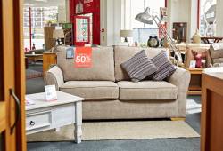 Sofa in a BHF furniture store with a red up to 50 per cent off tag