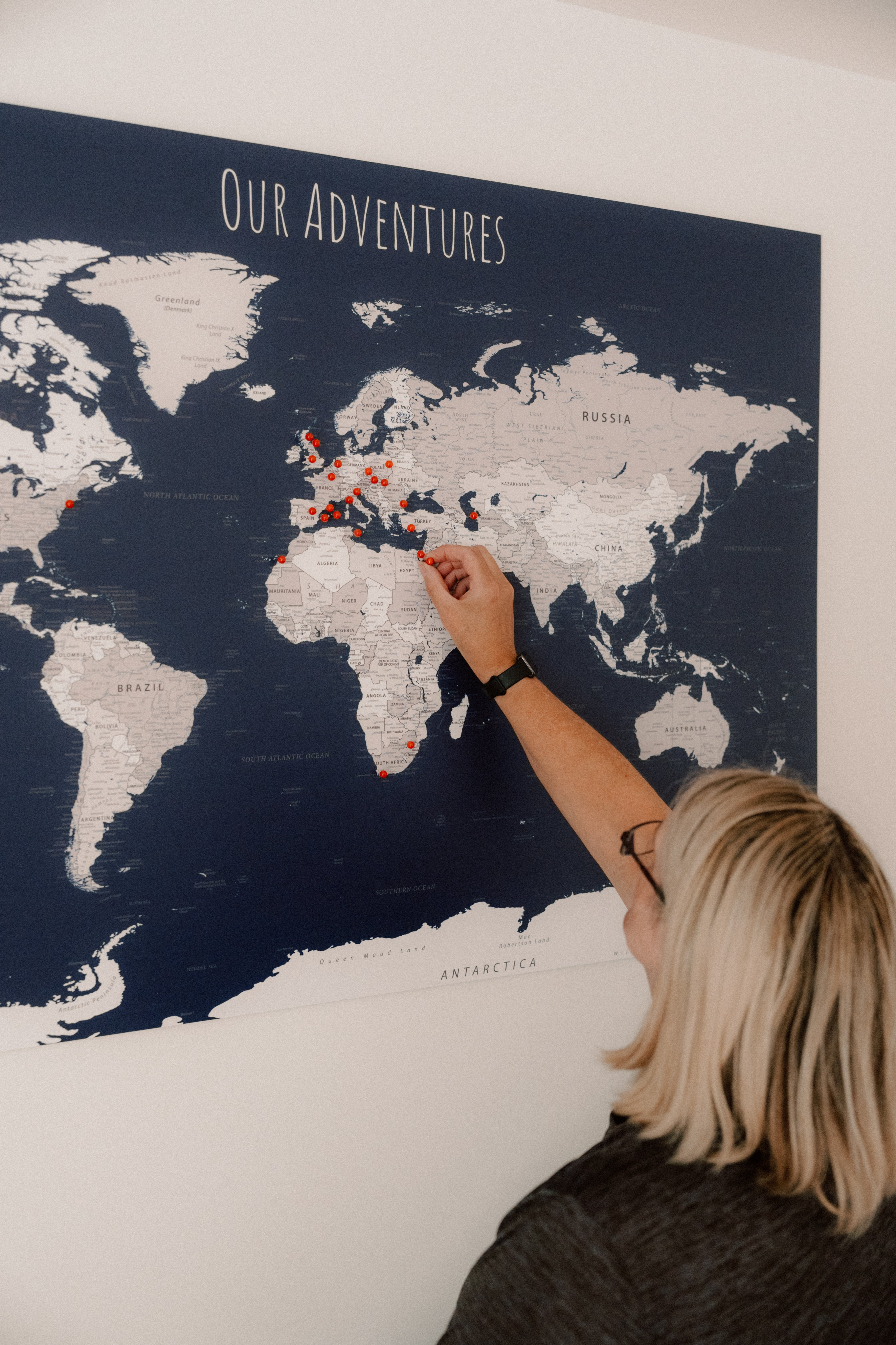 Allison Lawson puts a pin in a map