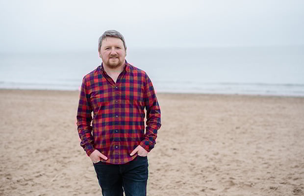 man called Bedwyr Gullidge on beach speaking to BHF about fatigue