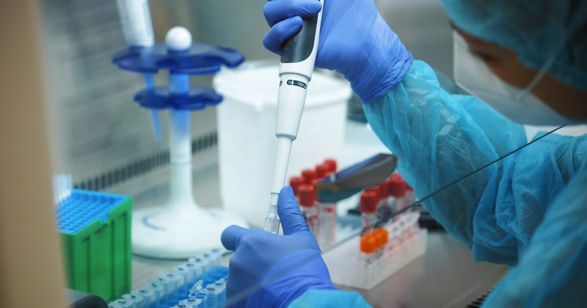 Female researcher from ethnic minority background working on lab experiments