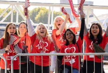 A group of female staff volunteering at a fundraising event