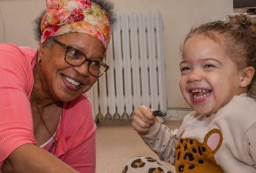 Heart Stories volunteer Bettina plays with a child