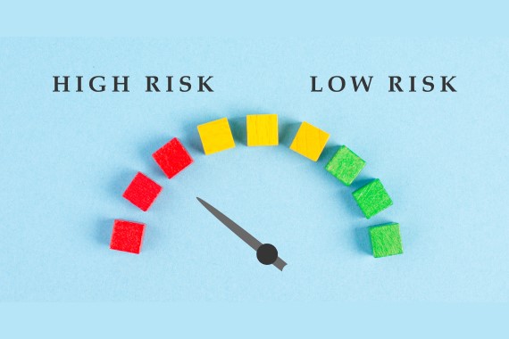 tachometer showing risk level going from high to low