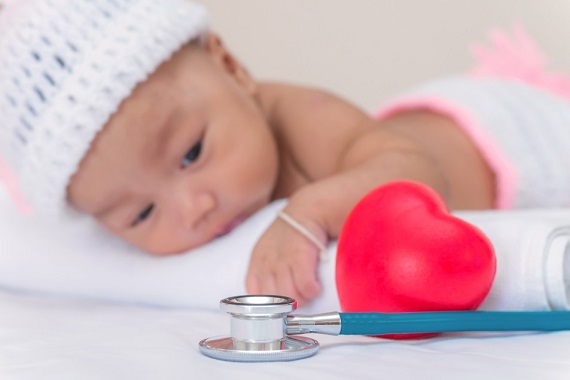 Baby lying next to a stethoscope