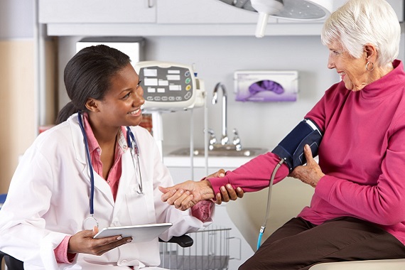 Older woman having blood pressure measured