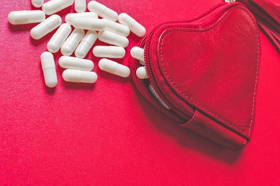 Pills in a heart shaped purse