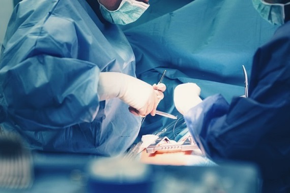 Surgeons operating on a patient