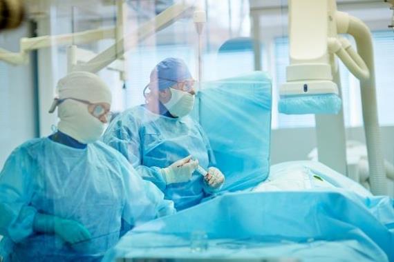 Surgeons performing coronary artery bypass surgery