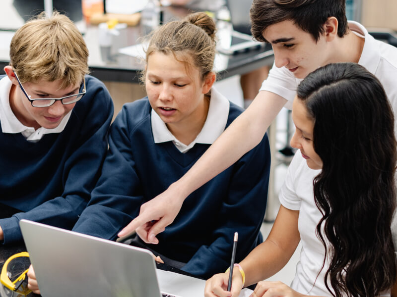 A team of school children working on a science project.