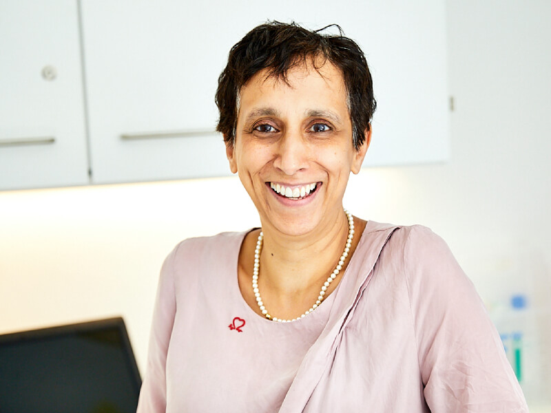 A BHF researcher smiles 