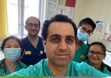 Dr Mohammed Shah in hospital scrubs