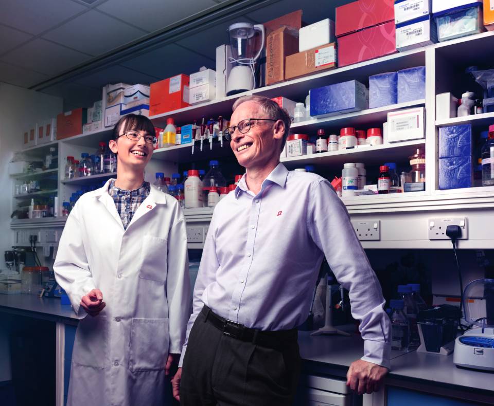 Professor Hugh Watkins and Professor Christine Seidman stood in a lab