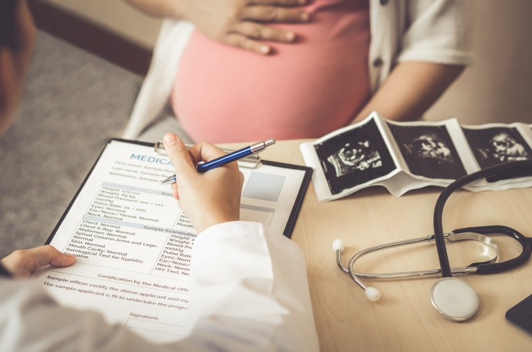 pregnant woman in doctor's office