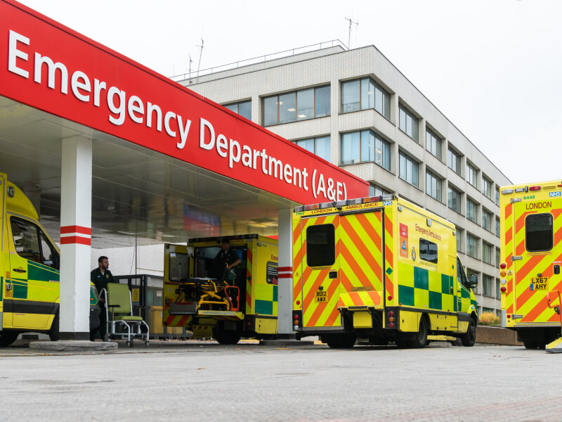 Ambulances parked outside of an emergency department