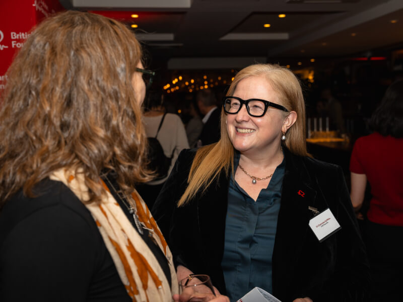BHF CEO Charmaine speaks to a woman at the Women in Science event 