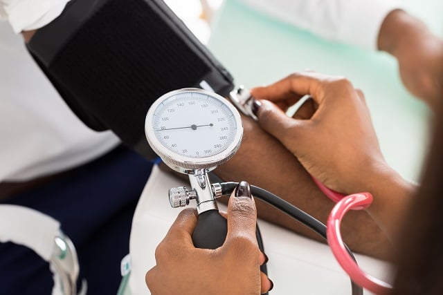 a patient having their blood pressure measured