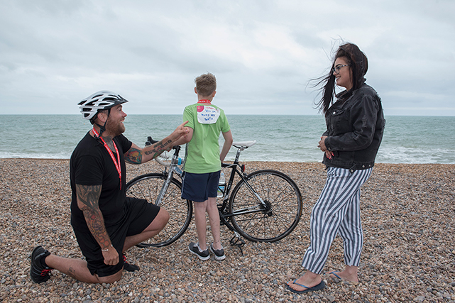 Doug proposes to Summer on the sea front at Brighton after completing the race. Doug's son Cameron has a sign on his back asking whether Summer will marry Doug.