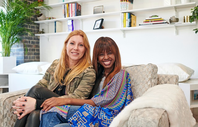 Interior designer, Lynne Lambourne and June Sarpong sitting in her BHF armchair together