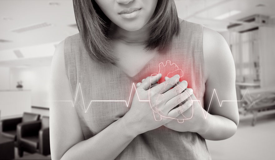 Woman clutches heart