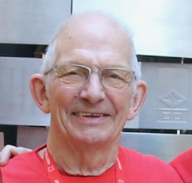 A portrait of Jim Waller, BHF case study, looking straight at the camera and wearing a red BHF T-shirt.