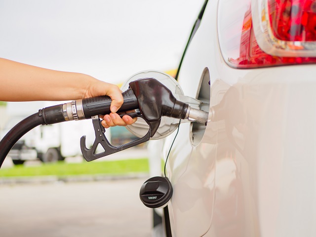 person filling a car with fuel