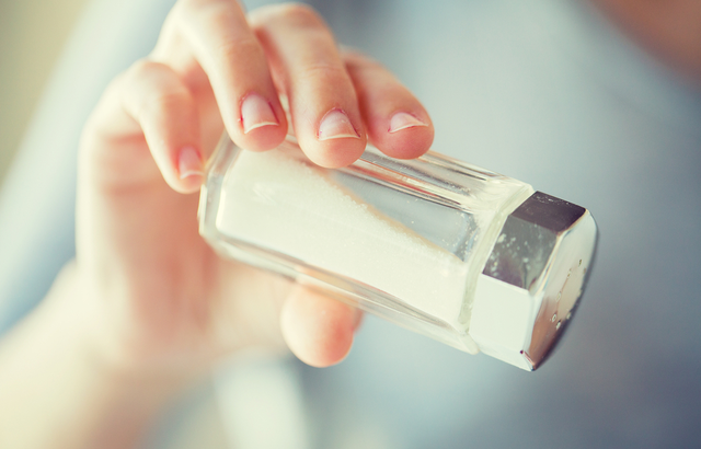 someone pouring salt