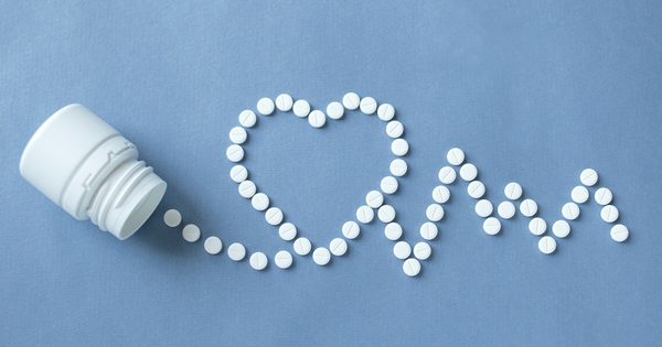 Tablets arranged in shape of heart electrocardiogram