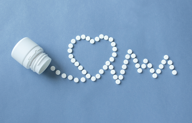 Tablets arranged in pattern of heart electrocardiogram