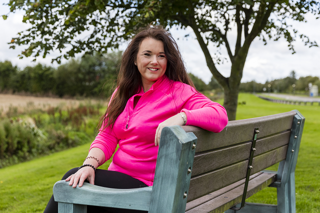 Jen Stevens sitting on a park bench