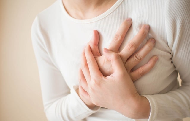 Woman suffering from chest pain