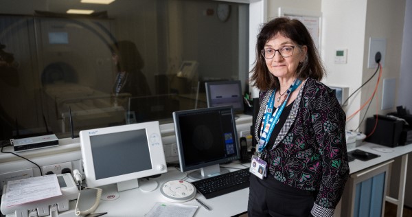 Professor Joanna Wardlaw standing in her lab