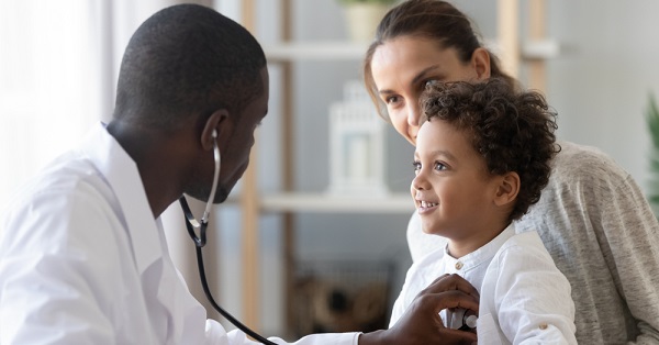 Doctor monitors child's heart 