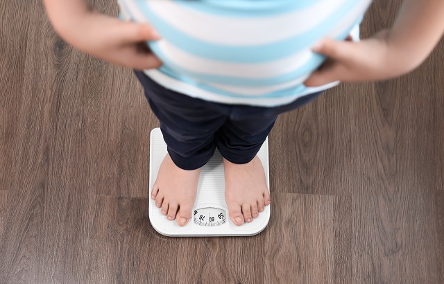 A child on a pair of scales